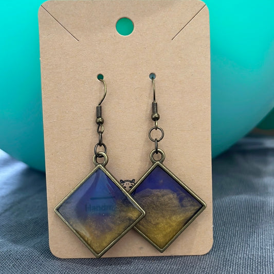 Blue/ gold swirl diamond earrings bronze frame